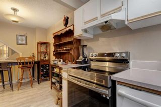 Photo 10: 77 7172 Coach Hill Road SW in Calgary: Coach Hill Row/Townhouse for sale : MLS®# A2094229