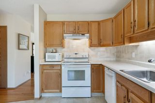 Photo 15: 21 Sandarac Circle NW in Calgary: Sandstone Valley Row/Townhouse for sale : MLS®# A2048786