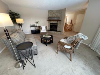 Photo 5: 15 Coach Side Terrace SW in Calgary: Coach Hill Row/Townhouse for sale : MLS®# A1071978