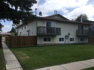 Photo 1: 5719-5721 54 Street: Rocky Mountain House 4 plex for sale : MLS®# A2074819