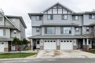 Photo 1: 10 Crystal Shores Cove: Okotoks Row/Townhouse for sale : MLS®# A1217849