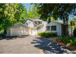 Photo 1: 26019 58 Avenue in Langley: County Line Glen Valley House for sale : MLS®# R2599684