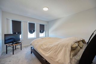 Photo 19: 239 Lucas Boulevard NW in Calgary: Livingston Row/Townhouse for sale : MLS®# A2033933