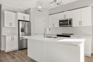 Photo 8: 806 32 Red Embers Parade NE in Calgary: Redstone Row/Townhouse for sale : MLS®# A2032219