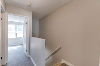 Photo 16: 56 123 Queensland Drive SE in Calgary: Queensland Row/Townhouse for sale : MLS®# A1228124