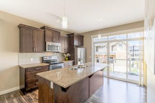 Photo 2: 555 Evanston Manor NW in Calgary: Evanston Row/Townhouse for sale : MLS®# A1218071