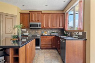 Photo 11: 41 Strathlea Grove SW in Calgary: Strathcona Park Detached for sale : MLS®# A2060523