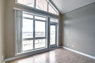 Photo 18: 14 140 Rockyledge View NW in Calgary: Rocky Ridge Row/Townhouse for sale : MLS®# A1199471