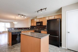 Photo 11: 208 Toscana Gardens NW in Calgary: Tuscany Row/Townhouse for sale : MLS®# A1127708