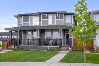 Photo 1: 295 Creekstone Way SW in Calgary: C-168 Semi Detached (Half Duplex) for sale : MLS®# A2140021