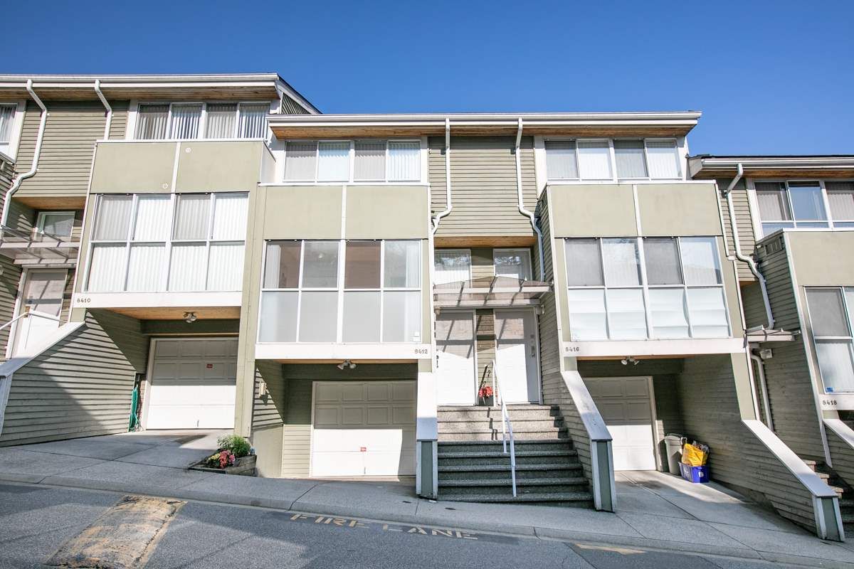 Main Photo: 8412 KEYSTONE Street in Vancouver: Champlain Heights Townhouse for sale in "MARINE WOODS" (Vancouver East)  : MLS®# R2395420
