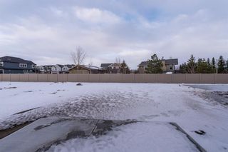 Photo 3: 66 Westmore Park SW in Calgary: West Springs Detached for sale : MLS®# A1065787