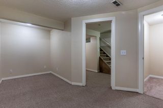 Photo 21: 521 Queenston Gardens SE in Calgary: Queensland Row/Townhouse for sale : MLS®# A1216265