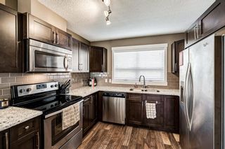 Photo 4: 1801 2461 Baysprings Link SW: Airdrie Row/Townhouse for sale : MLS®# A1228454