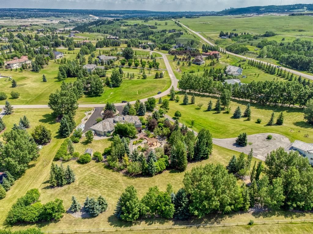 2.03 acre jewel box country residential estate featuring a breathtaking west facing “Butchart Gardens” inspired outdoor retreat, extensive lawn areas, 3 car garage & immaculate 4 bed walkout bungalow.