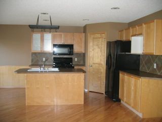 Photo 3: 10 Tuscany Meadows Bay NW in Calgary: House for sale : MLS®# A2045530