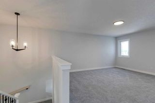 Photo 8: 82 Hotchkiss Manor SE in Calgary: C-385 Detached for sale : MLS®# A2101092