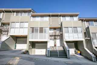 Photo 1: 8412 KEYSTONE Street in Vancouver: Champlain Heights Townhouse for sale in "MARINE WOODS" (Vancouver East)  : MLS®# R2395420