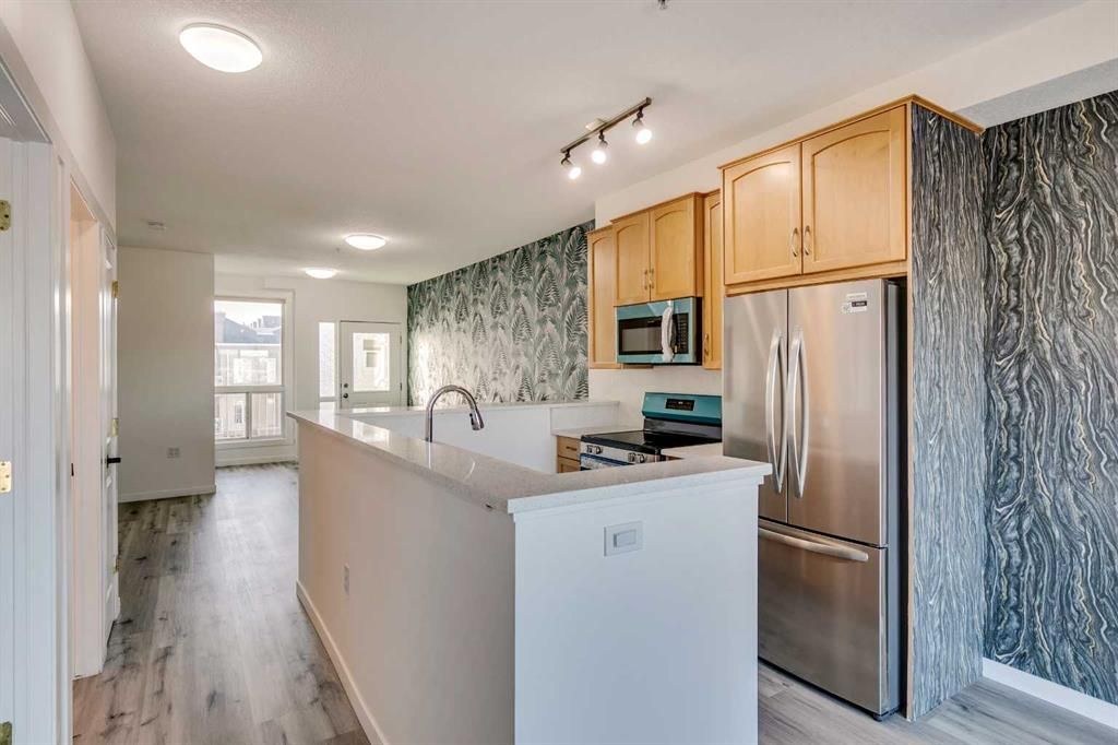 Main Photo: 310 1540 17 Avenue SW in Calgary: Sunalta Apartment for sale : MLS®# A2101024