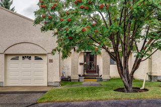 Photo 1: 71 Sandarac Circle NW in Calgary: Sandstone Valley Row/Townhouse for sale : MLS®# A1141051