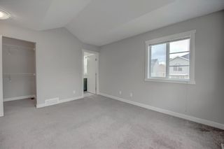 Photo 19: 405 Redstone View NE in Calgary: Redstone Row/Townhouse for sale : MLS®# A1224923