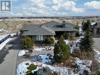 Photo 1: 211 Sandstone Place S in Lethbridge: House for sale : MLS®# A2037446