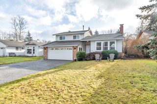 Photo 1: 19720 51 Avenue in Langley: Langley City House for sale in "Eagle Heights" : MLS®# R2747641