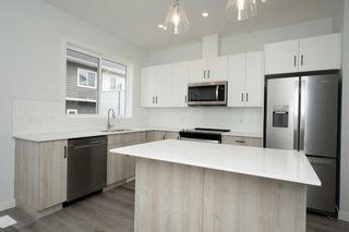 Photo 6: 306 137 Red Embers Link NE in Calgary: Redstone Row/Townhouse for sale : MLS®# A2129689