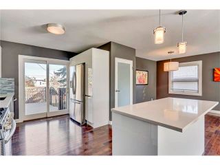 Photo 7: 5612 LADBROOKE Drive SW in Calgary: Lakeview House for sale : MLS®# C4036600