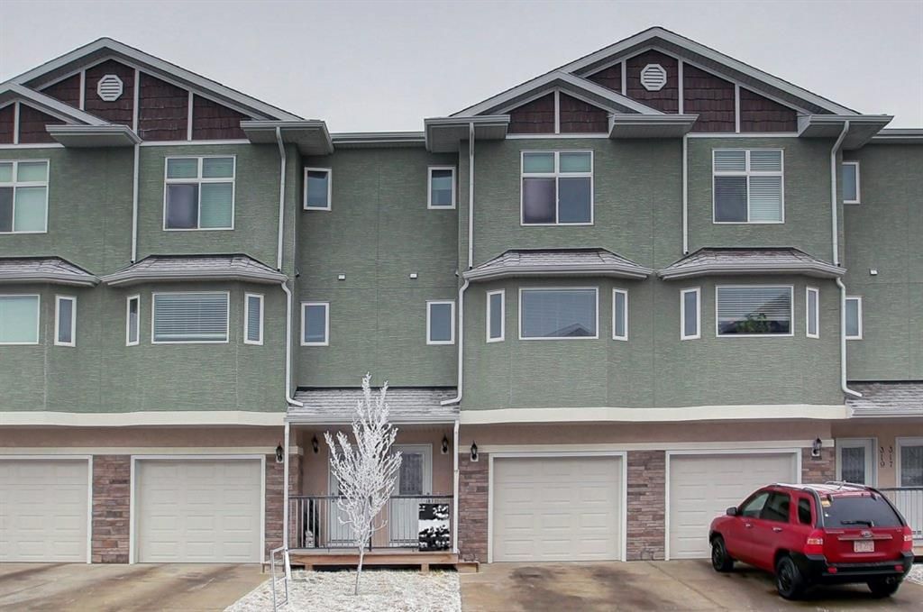Main Photo: 321 Strathcona Circle: Strathmore Row/Townhouse for sale : MLS®# A1211128