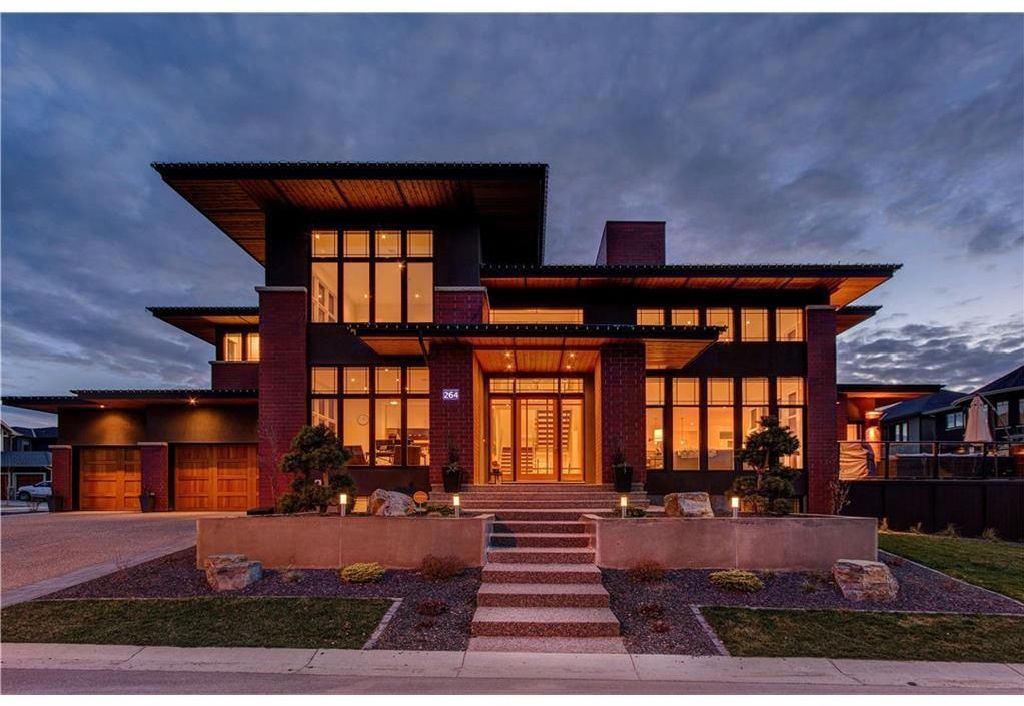 Stunning curb appeal welcomes you to this custom built home inspired by Frank Lloyd Wright Architecture