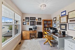 Photo 37: 100 Tremblant Way SW in Calgary: Springbank Hill Detached for sale : MLS®# A1230428