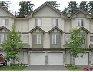 Photo 1: 35 14855 100TH Avenue in Surrey: Guildford Townhouse for sale in "HAMSTEAD MEWS" (North Surrey)  : MLS®# F2720151