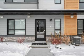 Photo 2: 34 Cranbrook Gardens SE in Calgary: Cranston Row/Townhouse for sale : MLS®# A2103164