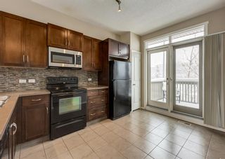 Photo 9: 1406 125 Panatella Way NW in Calgary: Panorama Hills Row/Townhouse for sale : MLS®# A2021769