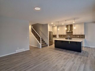 Photo 7: 62 Creekside Avenue SW in Calgary: C-168 Detached for sale : MLS®# A1178097