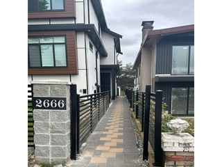 Photo 2: 2666 E 8TH Avenue in Vancouver: Renfrew VE 1/2 Duplex for sale (Vancouver East)  : MLS®# R2887094