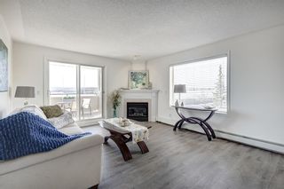 Photo 1: 2109 7451 Springbank Boulevard SW in Calgary: Springbank Hill Apartment for sale : MLS®# A2034205
