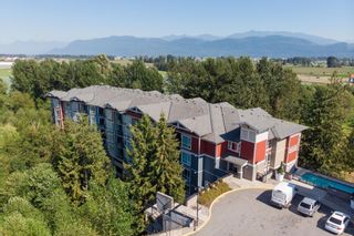 Photo 1: 310 2238 WHATCOM Road in Abbotsford: Abbotsford East Condo for sale in "Waterleaf" : MLS®# R2607465