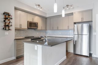 Photo 3: 104 300 Auburn Meadows Manor SE in Calgary: Auburn Bay Apartment for sale : MLS®# A2022411