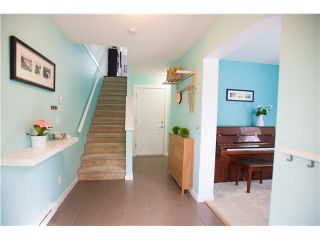 Photo 2: 74 101 FRASER Street in Port Moody: Port Moody Centre Townhouse for sale in "CORBEAU" : MLS®# V1116275