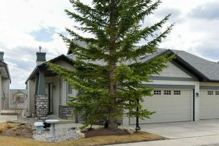 Photo 1: 233 Springbank Terrace SW in Calgary: Springbank Hill Semi Detached for sale : MLS®# A1212349