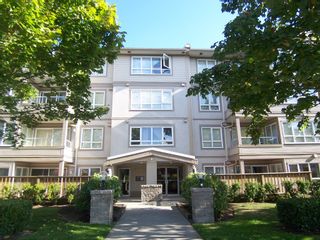 Photo 1: 207 4950 MCGEER Street in Vancouver: Collingwood VE Condo for sale in "Carleton" (Vancouver East)  : MLS®# V974793