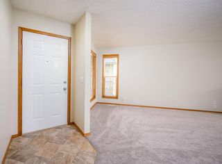 Photo 3: 208 Quigley Drive: Cochrane Semi Detached (Half Duplex) for sale : MLS®# A2050566