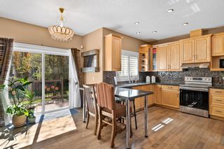 Photo 2: 58 39 Strathlea Common SW in Calgary: Strathcona Park Semi Detached for sale : MLS®# A1223906