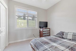 Photo 23: 8 148 Rockyledge View NW in Calgary: Rocky Ridge Row/Townhouse for sale : MLS®# A2069963