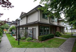 Photo 1: 107 19908 56 Avenue in Langley: Langley City Townhouse for sale in "Chenier Place" : MLS®# R2078671