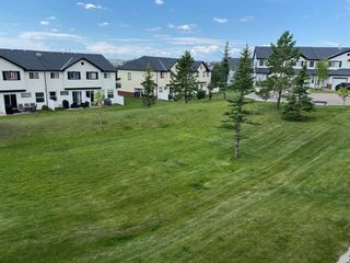 Photo 2: 49 Covemeadow Manor NE in Calgary: Coventry Hills Row/Townhouse for sale : MLS®# A1242037