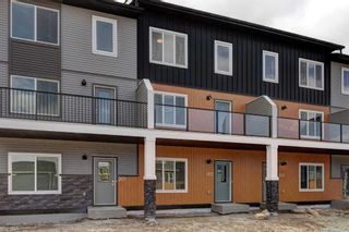 Photo 1: 202 335 Creekside Boulevard in Calgary: C-168 Row/Townhouse for sale : MLS®# A2124779