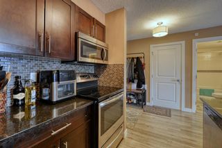 Photo 8: 8414 403 Mackenzie Way SW: Airdrie Apartment for sale : MLS®# A1206659